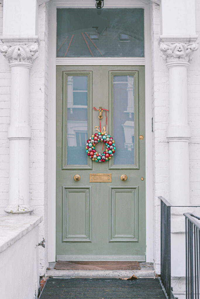 Bauble Christmas wreath on a mint green door